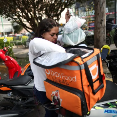 A delivery driver for Didi Food, getting ready to deliver orders, in Mexico City, Mexico, on October 16, 2024, could be one of many workers to benefit from labor reform for workers for digital labor platforms.