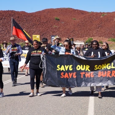 Protesters march near the site of the oil and gas project