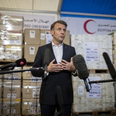 French President Emmanuel Macron talks to the media during a visit at Egyptian Red Crescent warehouses storing aid for Gaza, in the Egyptian border town of El-Arish, Egypt, on April 8, 2025.