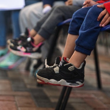 Deported children, along with their parents, sit in a migration office after being processed by staff of the Guatemalan Immigration Institute after arriving on deportation flights from the United States and Mexico, in Guatemala City, Guatemala, January 23, 2024.