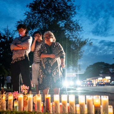 People pay their respects during a demonstration near a small memorial for Silverio Villegas-Gonzalez on September 13, 2025 in Franklin Park, Illinois, US.