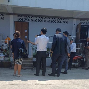 Vietnamese police questioning refugees in Thailand, March 14, 2024.