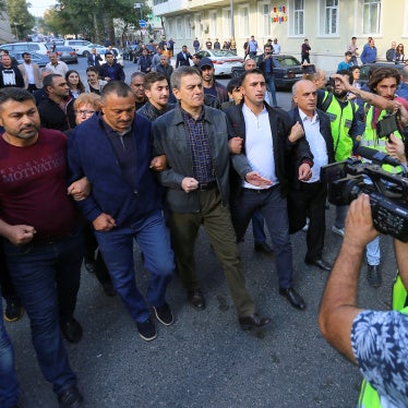 Head of the Popular Front Party of Azerbaijan Ali Karimli (C) and his supporters hold an unauthorized rally to demand the right to freedom of assembly, in Baku, Azerbaijan, October 19, 2019.