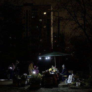 A fruit and vegetable stall in a residential neighborhood is illuminated by small lamps during a blackout caused by Russia’s attacks on Ukraine’s power infrastructure, in Kyiv, Ukraine, on November 6, 2025.