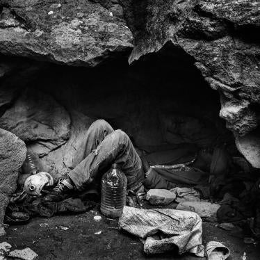 Nador, Morocco, November 2012 – A migrant from Mali lying down in a cave used as shelter. In the forests and mountains that surrounded Nador, groups of Sub-Saharan African migrants survive and wait for the right moment to attempt to cross the border.