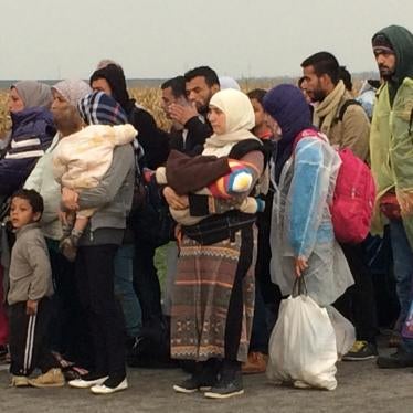 Migrants queuing outside Tovarnik