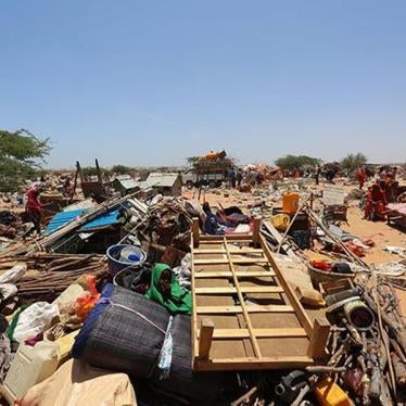 A child surrounded by her family’s belongings during the massive forced eviction by Somali authorities of a displaced person’s camp in the Kadha (formerly Dharkenley) district of Mogadishu, Somalia on March 4, 2015.
