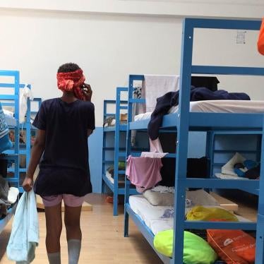 "Yodit," a 16-year-old girl from Eritrea, talks on the phone to her mother for the first time after her rescue at sea and arrival to Pozzallo hotspot, Sicily, Italy.