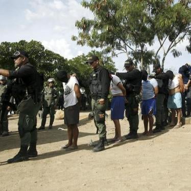 Venezuelan soldiers detain men who allegedly had links to a Colombian paramilitary group during an OLP raid in Táchira state, Venezuela.