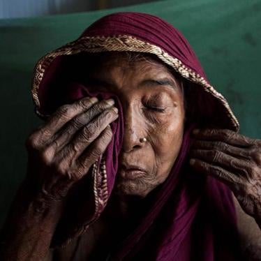 Anuwara Begum, in her 60s, cries while remembering her son-in-law, a farmer who died from arsenic-related illnesses. She herself has arsenic-related health conditions, but has never seen a doctor. Iruain village of Laksam Upazila in Comilla district, Bang