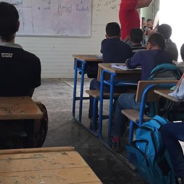 Syrian children attend class in a school in the Zaatari refugee camp in northern Jordan, October 20, 2015. The school taught Syrian girls in the morning and boys in the afternoon, but lacked electricity, heating, and running water. 