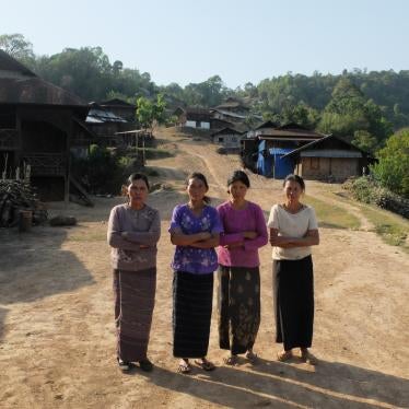 Residents of Ngot Ngar village, Kutkai township, Shan State, in front of their homes, which have come under attack from the Burmese military. 