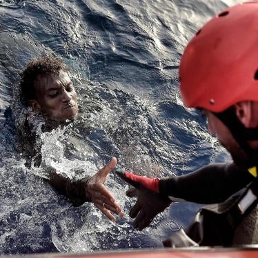 A migrant is rescued from the mediteranean sea by a member of Proactiva Open Arms NGO some 20 nautical miles north of Libya on October 3, 2016. 