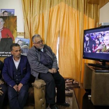 The father and relatives of Palestinian Abd Elfatah Ashareef watch the TV broadcast of the sentencing hearing of Israeli soldier Elor Azaria, in the West Bank City of Hebron February 21, 2017.