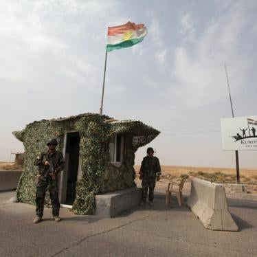 Peshmerga forces stand guard at a checkpoint in northern Iraq. 