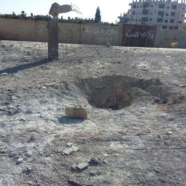 The impact crater in the Martyr Kiwan school courtyard from a Syrian-Russian airstrike on June 14, 2017. Seven of the eight casualties, including a child, were from a displaced family and had been sheltering in the school. 