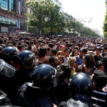 Demonstrators hold flares during a demonstration against a bill that would protect those accused of corruption from prosecution on Habib Bourguiba Avenue in Tunis, Tunisia, May 13, 2017. 