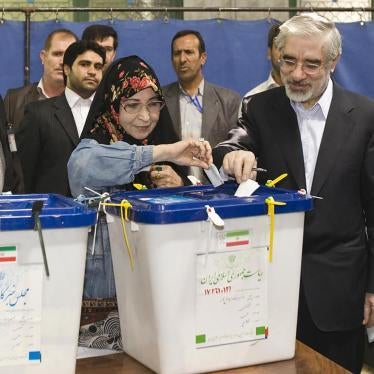 Caption: Presidential candidate Mirhossein Mousavi (R) and his his wife Zahra Rahnavard cast their ballots during the Iranian presidential election in southern Tehran June 12, 2009. © 2009 Reuters