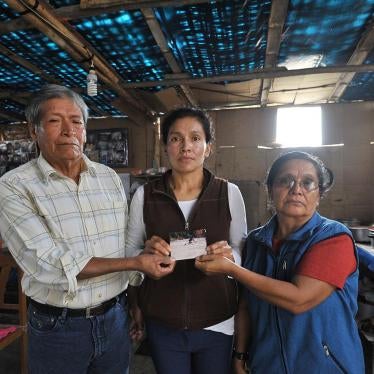 Antenor Hoyos Cubas and María Concepción Sagastegui Tapia, with their daughter, at their home in the outskirts of Lima, Peru, May 2017. Soldiers forcibly disappeared the couple’s son Nelson in June 1992.