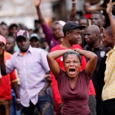 A woman reacts near the dead body of a protester in Mathare, in Nairobi, Kenya August 9, 2017. REUTERS/Thomas Mukoya