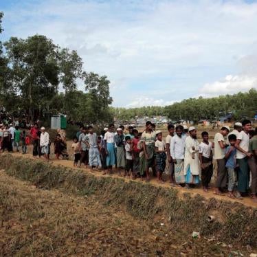 Rohingya refugees wait for blankets to be distributed at Kutupalong camp, near Cox's Bazar, Bangladesh on December 10.