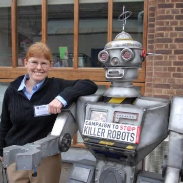 Bonnie Docherty, senior researcher at Human Rights Watch, with a “friendly robot” at the launch of the Campaign to Stop Killer Robots, April 2013. 