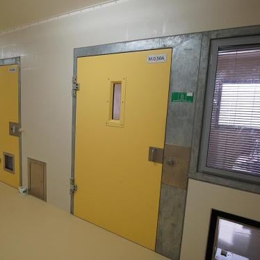 A prisoner lies in his solitary confinement cell in the safety unit at Lotus Glen Correctional Centre, northern Queensland.  