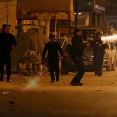 Police officers fire tear gas to break up a protest during demonstrations against rising prices and tax increases, in Tunis, Tunisia, January 10, 2018.