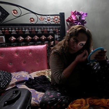 a member of the transgender community, applies make up as she prepares for Shakeela's party in Peshawar, Pakistan January 22, 2017.