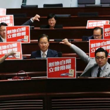 Pro-democracy lawmakers react after Legislative Council passed a controversial bill to introduce mainland Chinese laws inside an upcoming high-speed rail station, in Hong Kong, China June 14, 2018.