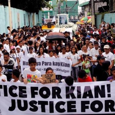 Mourners display a streamer during a funeral march for Kian delos Santos, a 17-year-old student who was shot during anti-drug operations in Caloocan, Metro Manila, Philippines August 26, 2017.