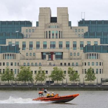A motorboat passes by the MI6 building in London August 25, 2010.