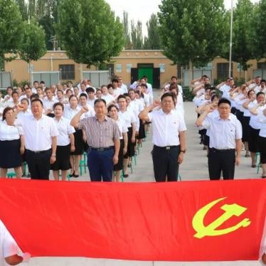 Village officials swear allegiance to the Chinese Communist Party in Kashgar, Xinjiang. 