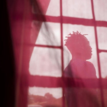 A young transgender woman at a friend’s house seeking temporary shelter in Lilongwe, Malawi. 