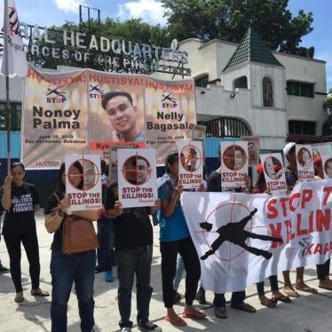People protest outside of the Armed Forces of the Philippines general headquarters on June 16, against the recent killings of activists Nonoy Palma, Ryan Hubilla, and Nelly Bagasala. 