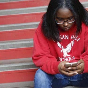 A student checks her phone at Nathan Hale Elementary School in Chicago