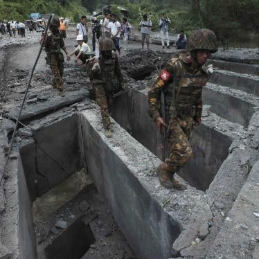 Soldiers walk over the Goktwin bridge, damaged by an explosion, in Nawnghkio, northern Shan State, Myanmar, August 15, 2019.