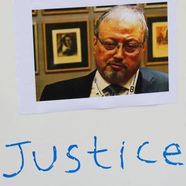 An Indonesian journalist holds a placard during a protest over the disappearance of Saudi journalist Jamal Khashoggi in front of the Saudi Arabia embassy in Jakarta, Indonesia, October 19, 2018. 