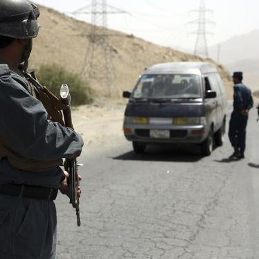 Afghan police officers search a vehicle at a checkpoint on the Ghazni highway, in Maidan Shar, west of Kabul, Afghanistan, Monday, Aug. 13, 2018.
