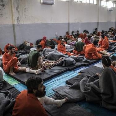Men, suspected of being affiliated with the Islamic State, gather in a prison cell in the northeastern Syrian city of Hasakeh on October 26, 2019.  