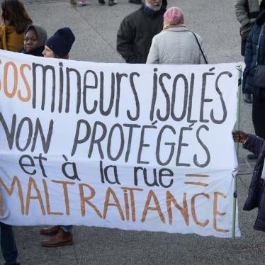 Migrants hold a banner reading "SOS isolated minors unprotected and on the street = abuse" as they demonstrate against the living conditions of unaccompanied migrant minors and the lack of accommodation, outside the departmental council building in Marsei