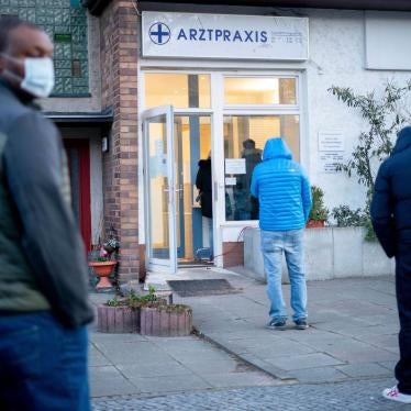 Patients line up in front of a medical practice in Berlin, Germany, to give blood samples for Covid-19 testing and possible detection of coronavirus antibodies, March 30, 2020.