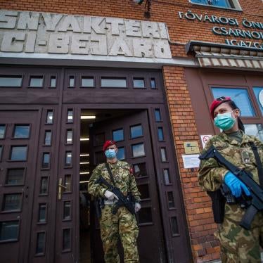 Military police officers patrol at a market in Budapest, Hungary, March 31, 2020.