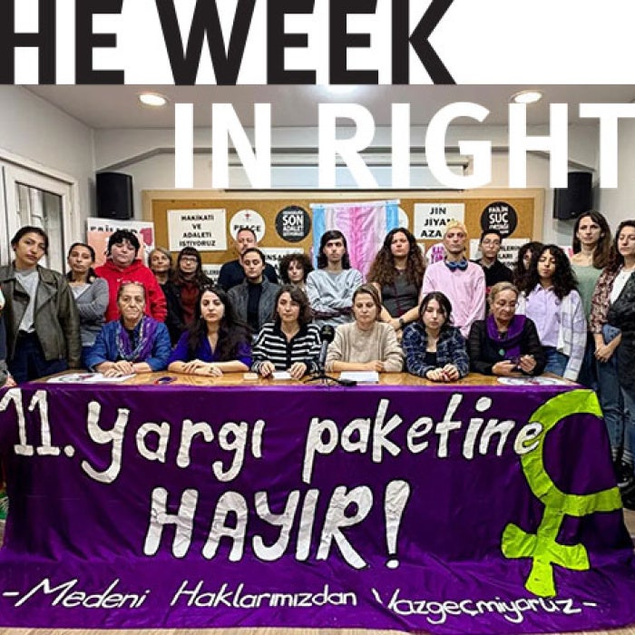 Activists hold banner. 