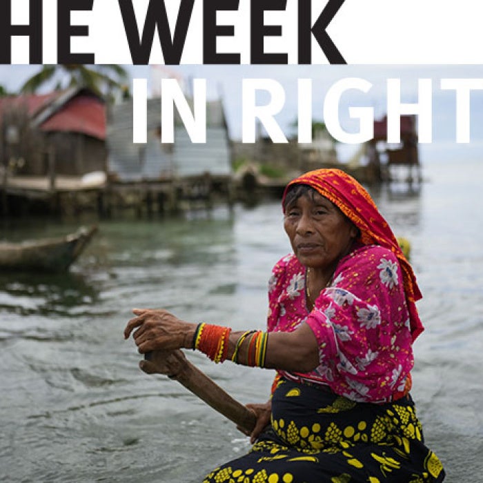 Two figures steer boats. 